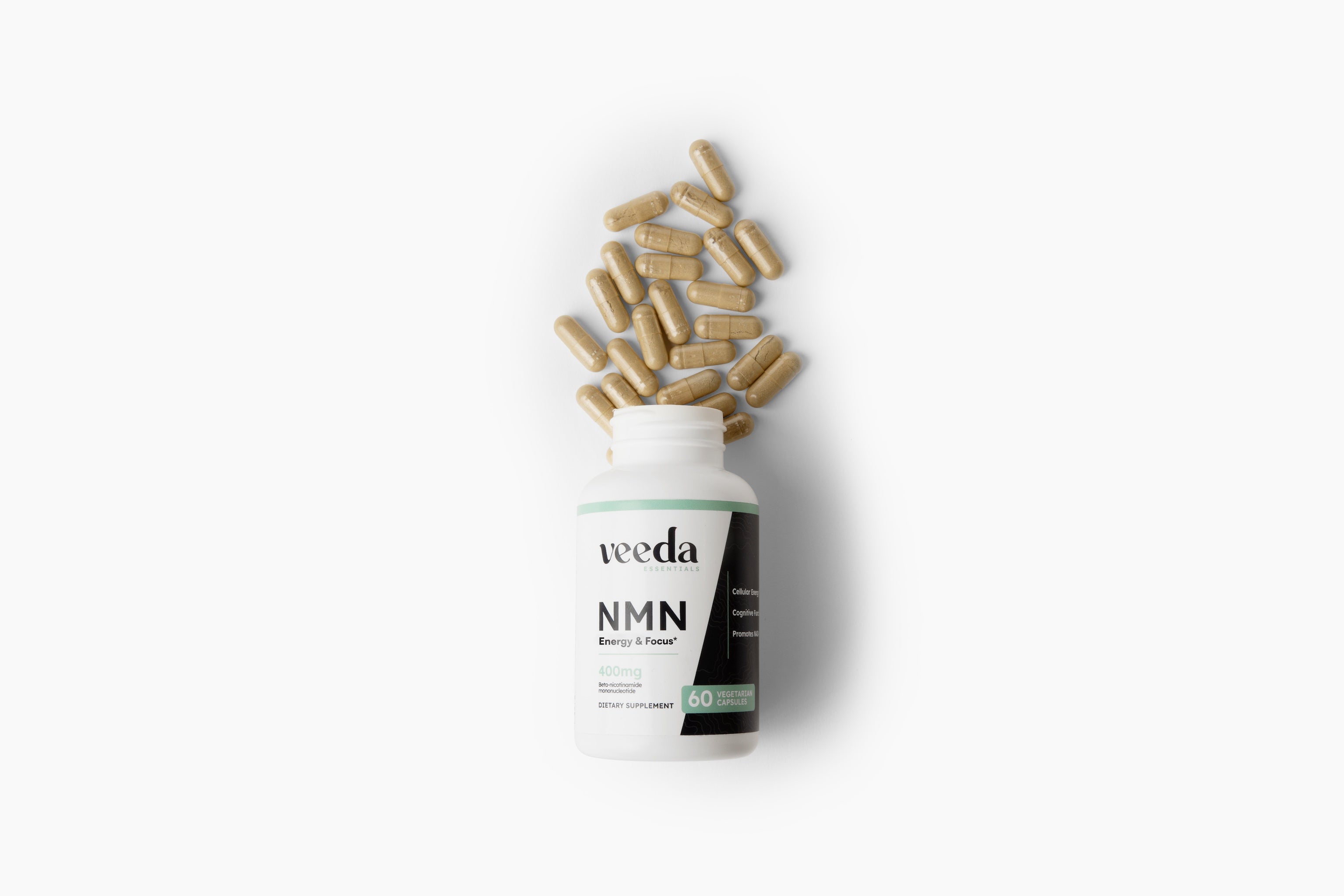 Bottle of VEEDA NMN with scattered capsules on a white background